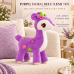 Young girl hugging a purple floral deer plush toy with green antlers sitting on a carpet.