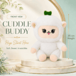 fluffy white lamb plush toy with a green leaf accent on its head sitting on a marble pedestal.